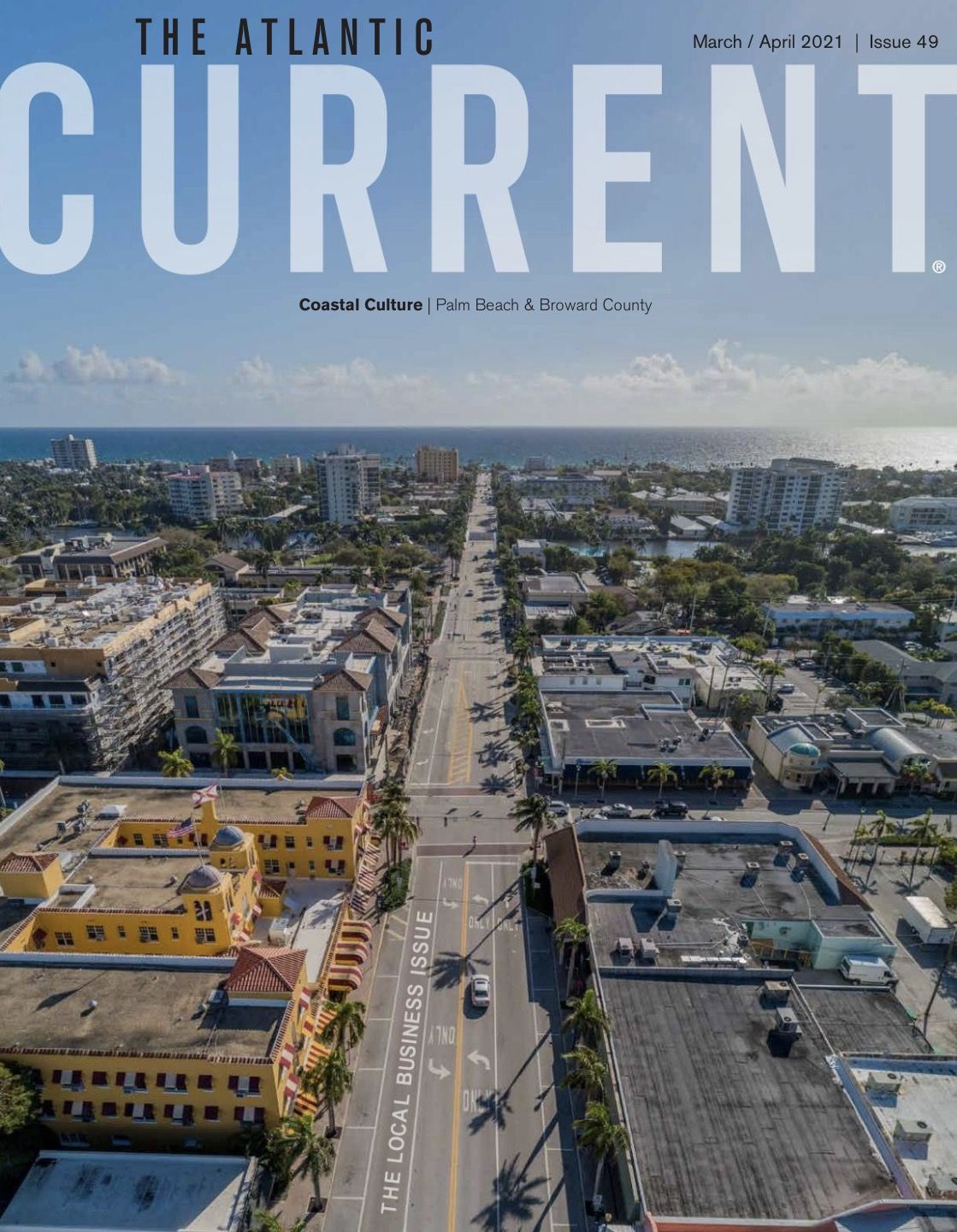 Atlantic Current magazine cover, Issue 49, March/April 2021, the Local Business Issue: an aerial of a main street running down to the ocean