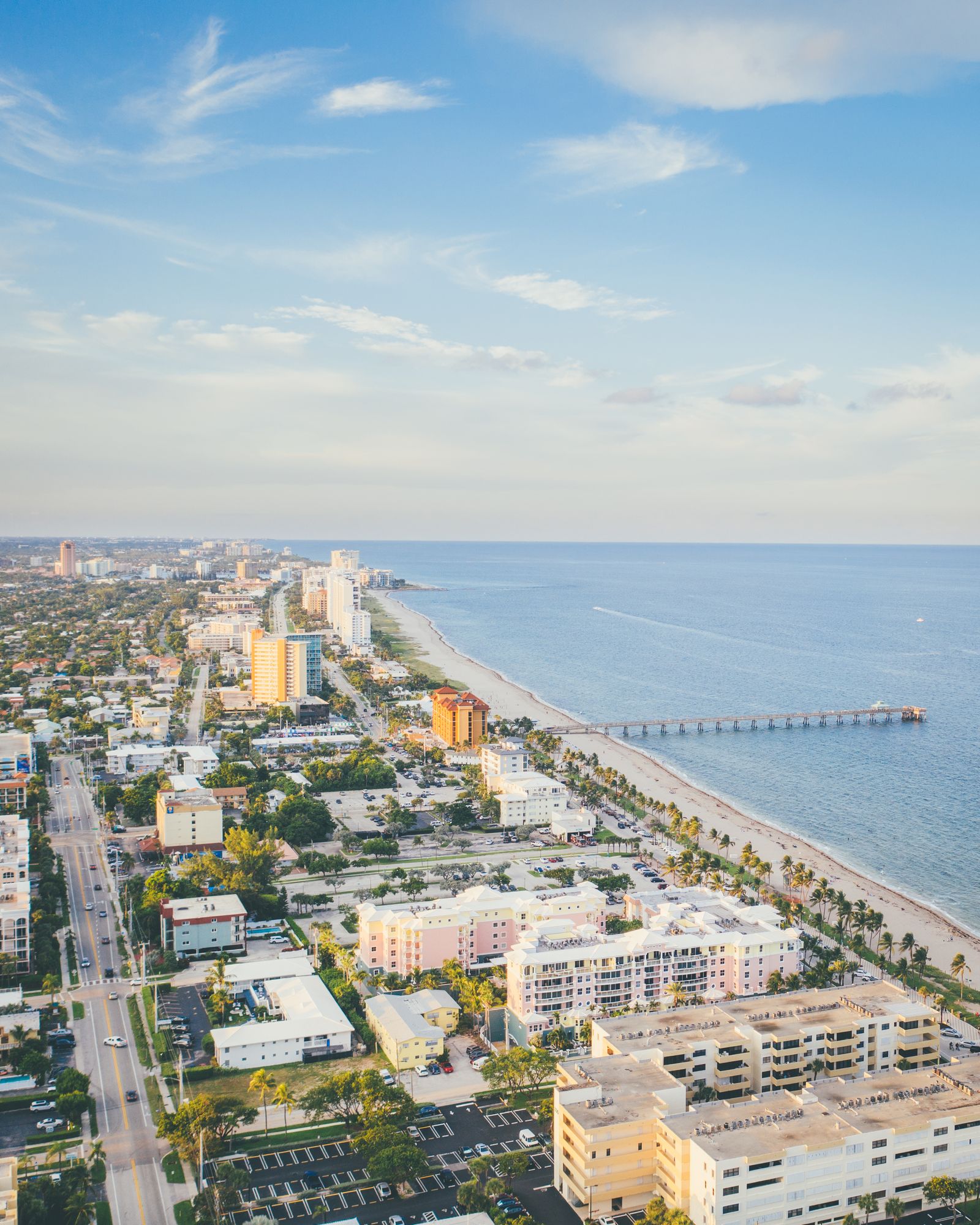 Aerial view of Deerfield Beach with its fishing pier, hotels and ocean